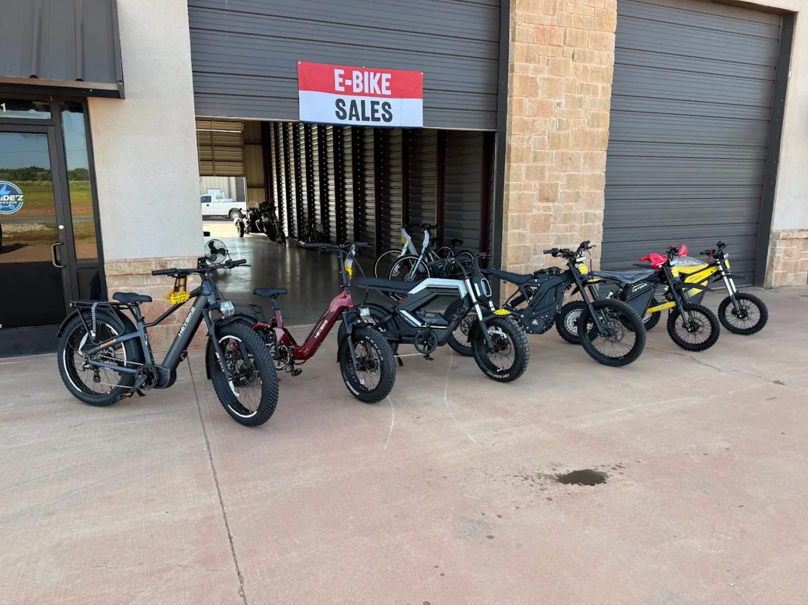 Electric bikes lined up outside the E-Ridez ABI shop near Abilene