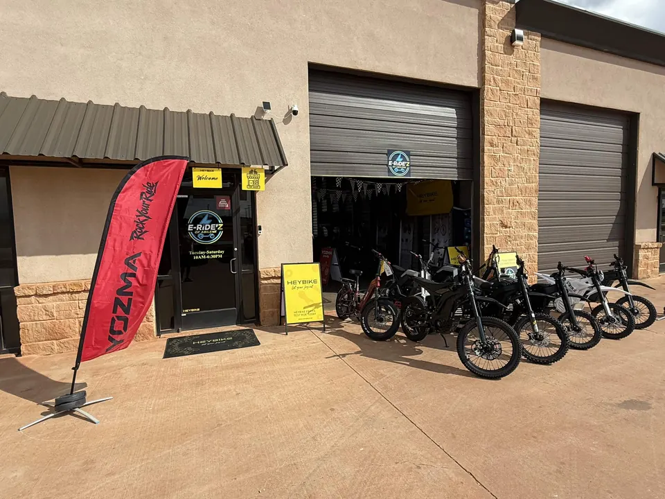 The E-Ride'z of Abilene entrance and open showroom bay with electric dirt bikes lined up outside